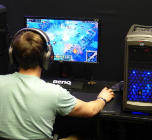 Gamer with computer monitors